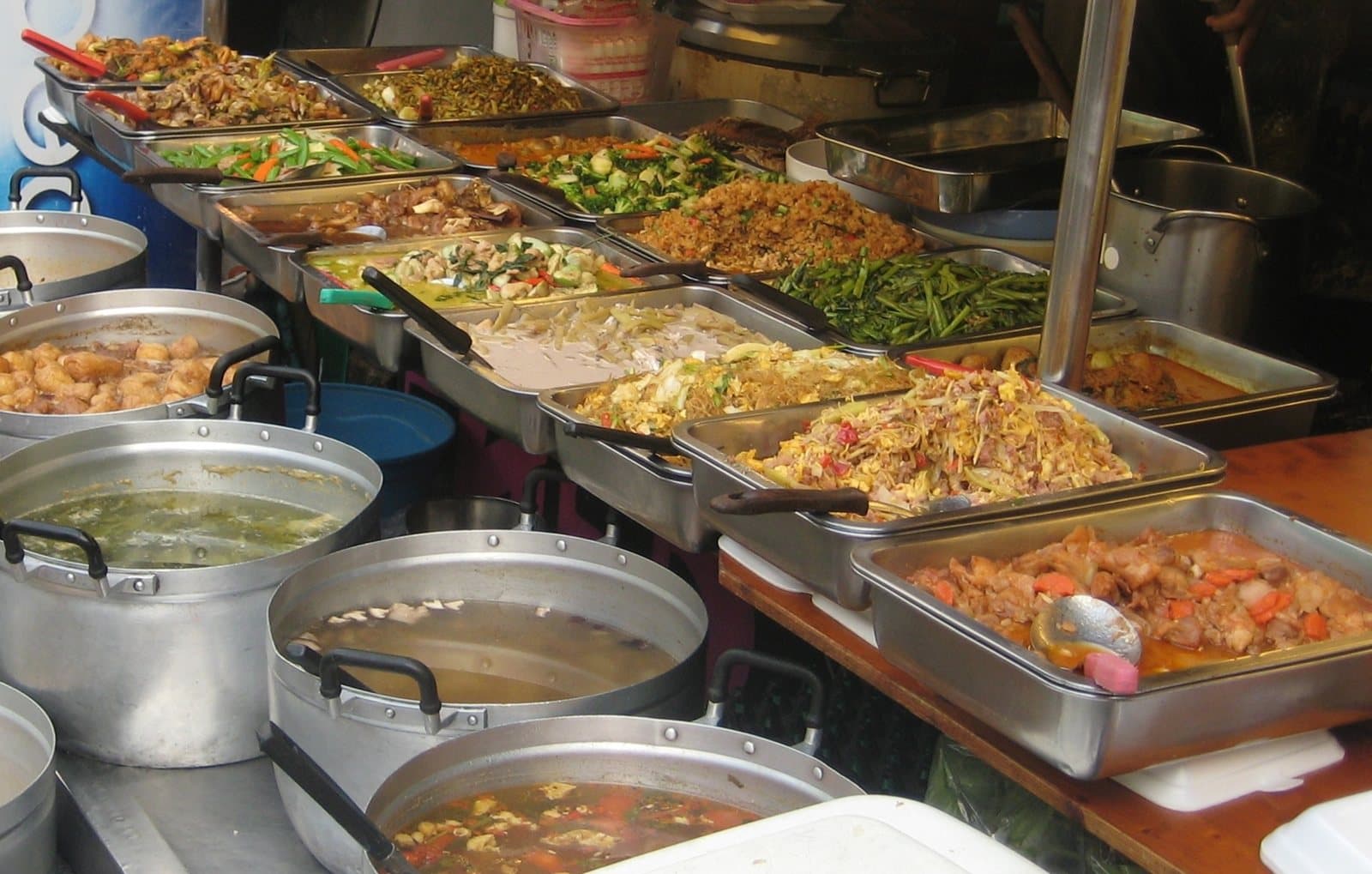 Trays of curries and stir-fries at a rice-and-curry stall