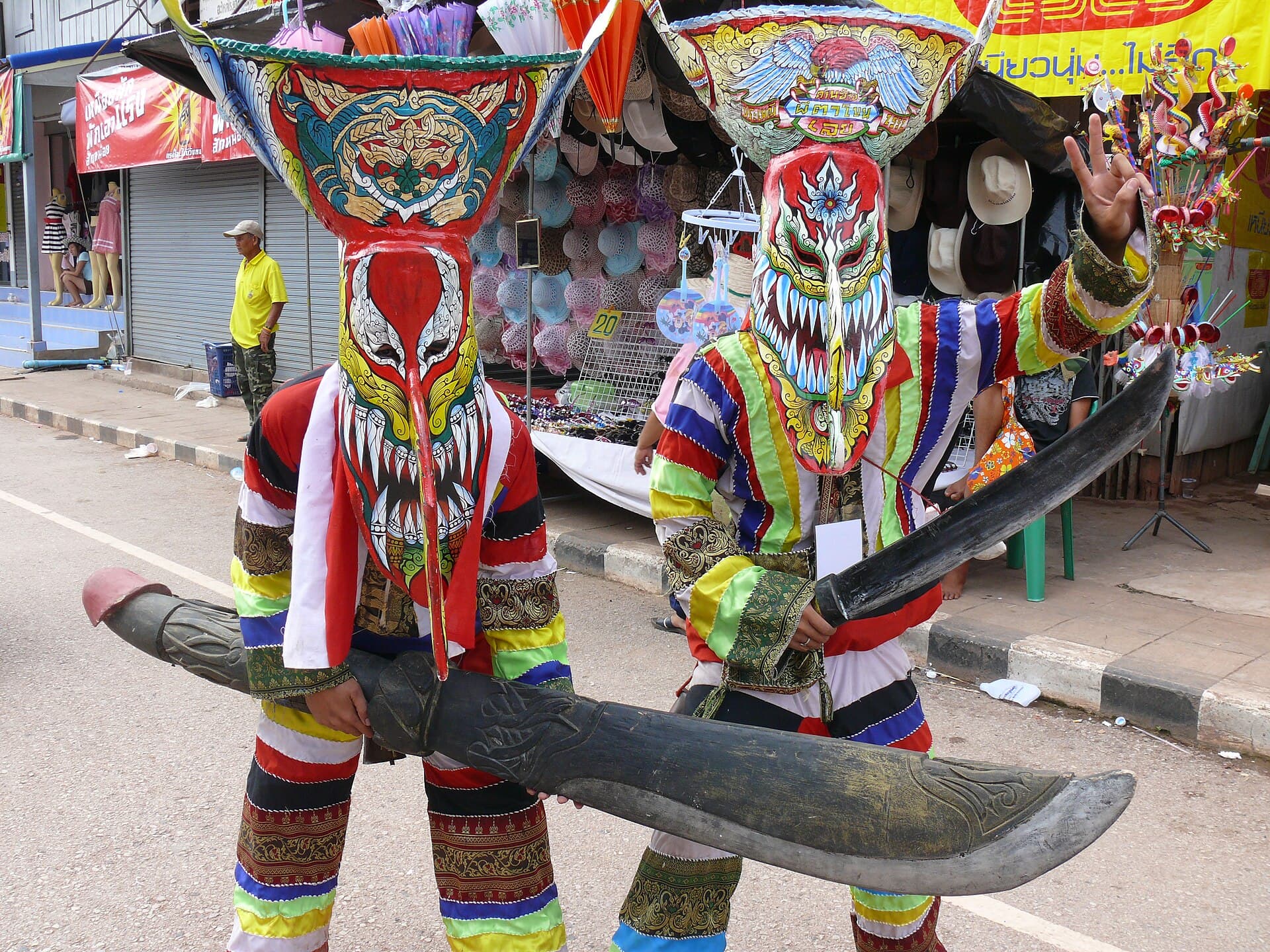 Phi Ta Khon dancers in masks and costumes